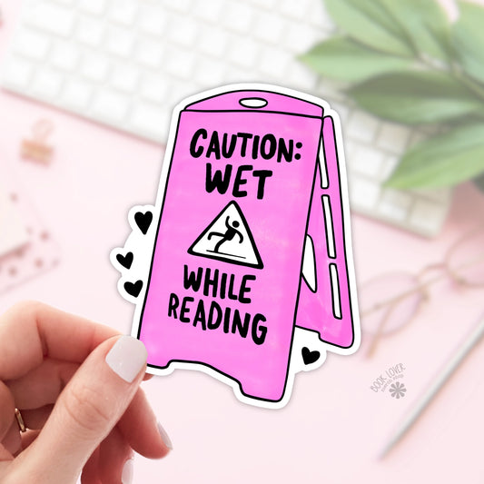 Caution: Wet While Reading Sticker